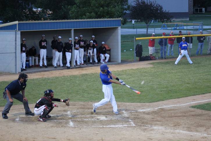 Baseball player hitting the ball